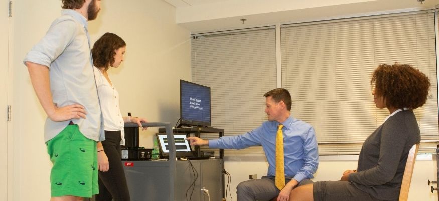 Dr. Keith Cole working with lab members